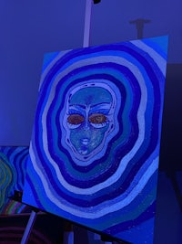 a blue painting on a wall